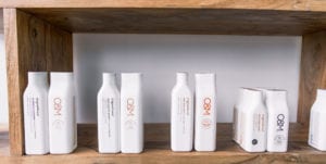 Shelf with bottles of hair product